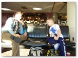 Brad and Duncan play Go Fish at Phoenix Sky Harbor Airport while they wait for their flight to Kansas.